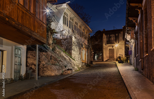 Fototapeta Naklejka Na Ścianę i Meble -  Gurzuf's antiquity (Kirova street in Gurzuf, Crimea before dawn)