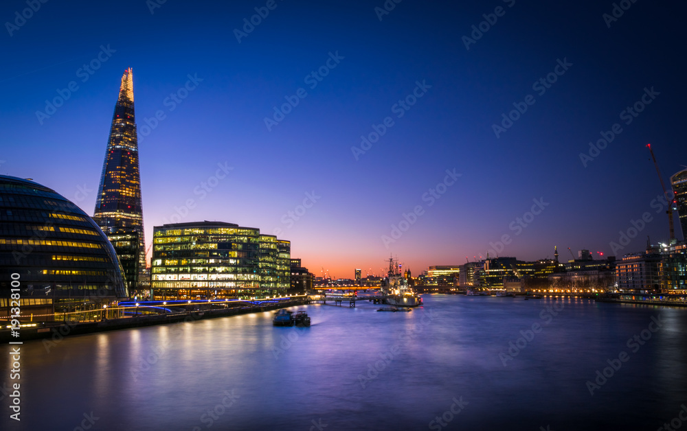 Dusk view of London Bridge and Central London buildings from Tower Bridge