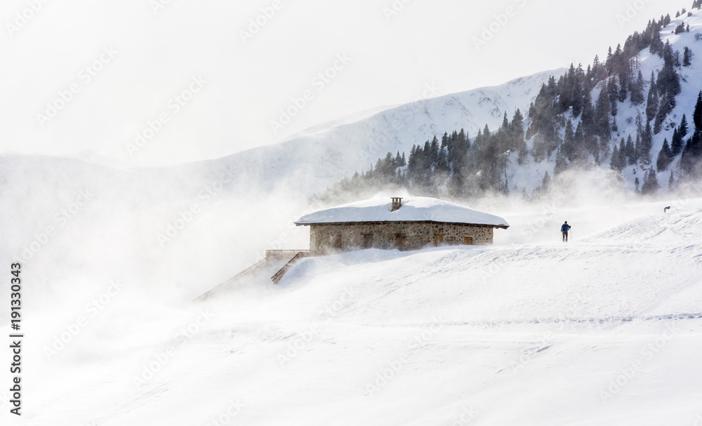 Snowstorm in the mountains at winter time. Mountains of Trentino Alto Adige, South Tyrol