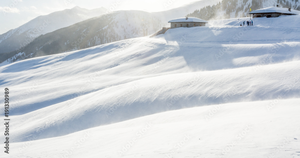 Snowstorm in the mountains at winter time. Mountains of Trentino Alto Adige, South Tyrol