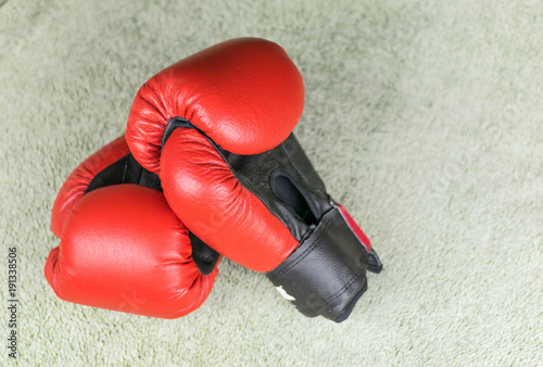Red boxing gloves do not have a gray background.