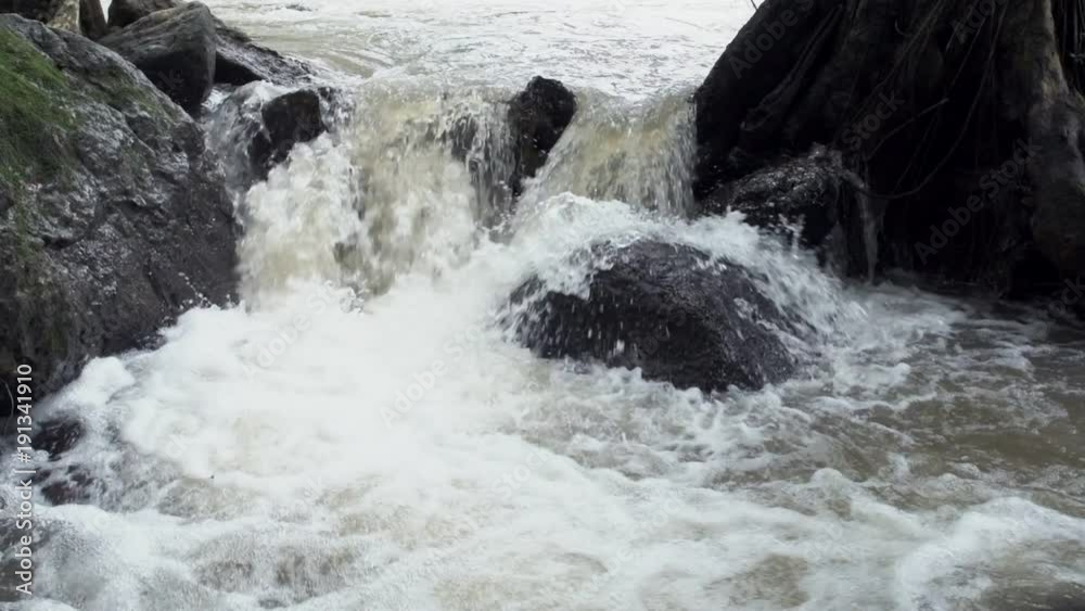 Water flowing through waterfall. Slow motion shot. White water in thailand. Water flowing through waterfall. Slow motion shot. White water in thailand.