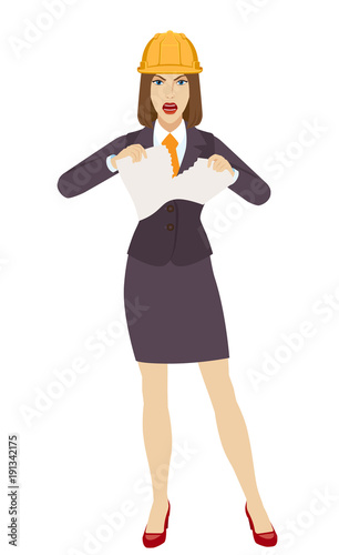 Businesswoman in construction helmet  tearing paper