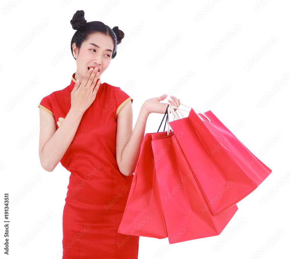 happy woman holding shopping bag on chinese new year celebration isolated on white background happy woman holding shopping bag on chinese new year celebration isolated on white background