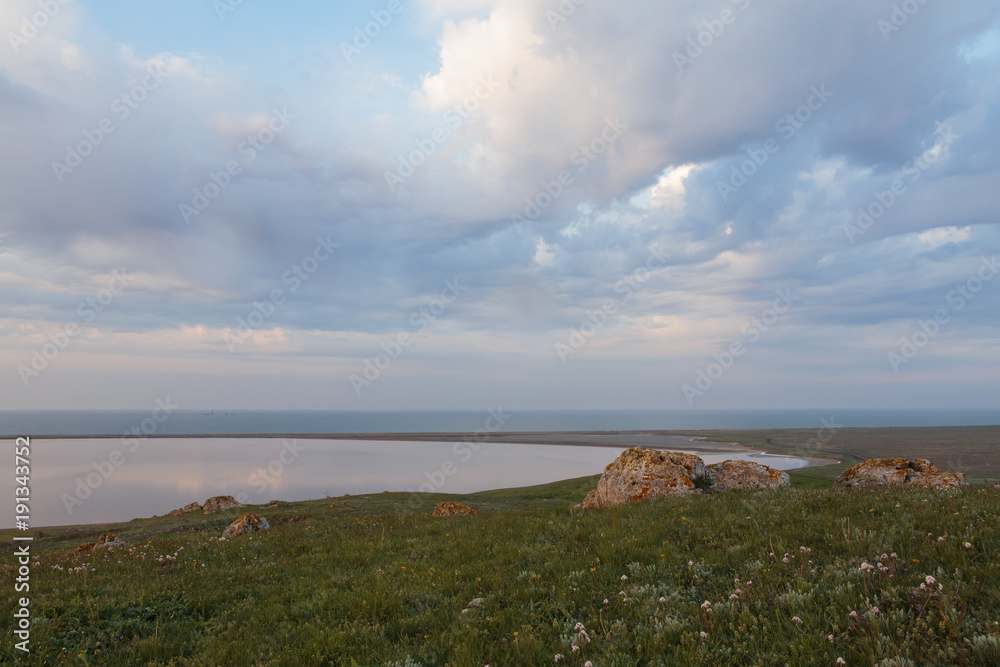 The movement of clouds in the spring in the steppe part of the Crimea peninsula at Cape Opuk.