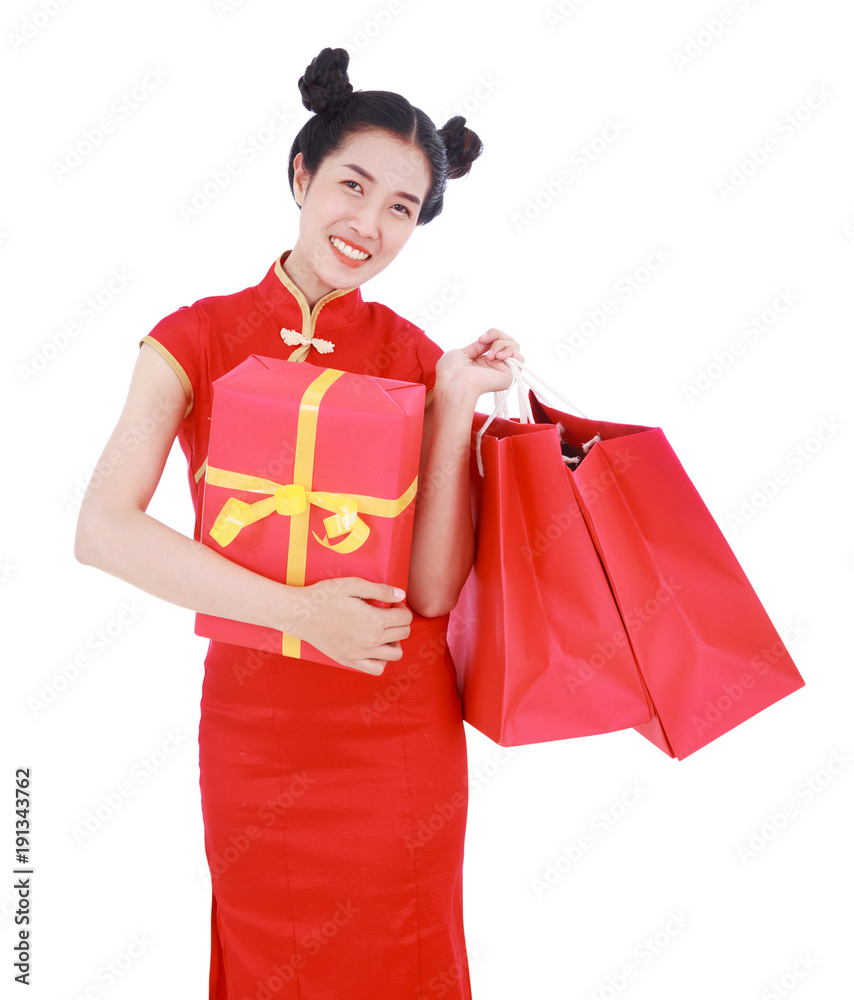 happy woman holding shopping bag and red gift box in concept chinese new year celebration isolated on white background happy woman holding shopping bag and red gift box in concept chinese new year celebration isolated on white background