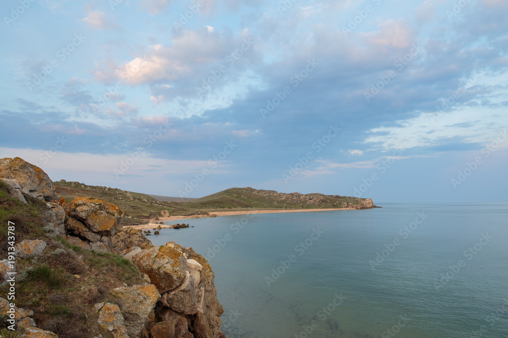 The movement of clouds in the spring in the steppe part of the Crimea peninsula at Cape Opuk. The movement of clouds in the spring in the steppe part of the Crimea peninsula at Cape Opuk.