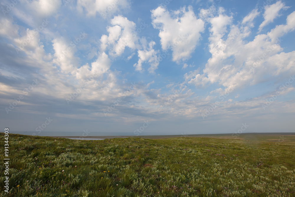 The movement of clouds in the spring in the steppe part of the Crimea peninsula at Cape Opuk.