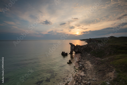 The movement of clouds in the spring in the steppe part of the Crimea peninsula at Cape Opuk. photo