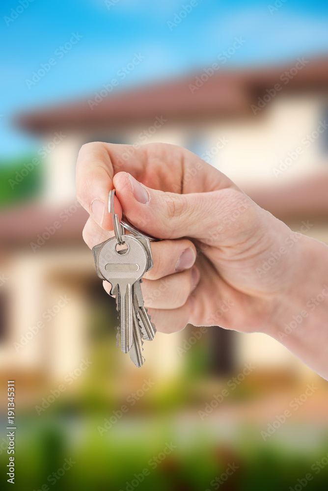 Person Hand Holding House Key Person Hand Holding House Key