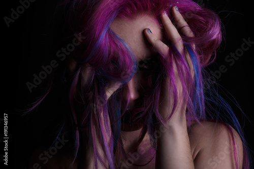 Crazy Colored young girl posing in studio