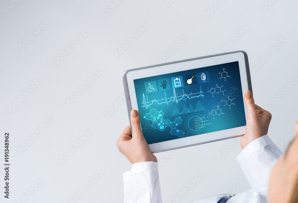 Close of female doctor hands working with tablet pc computer Close of female doctor hands working with tablet pc computer