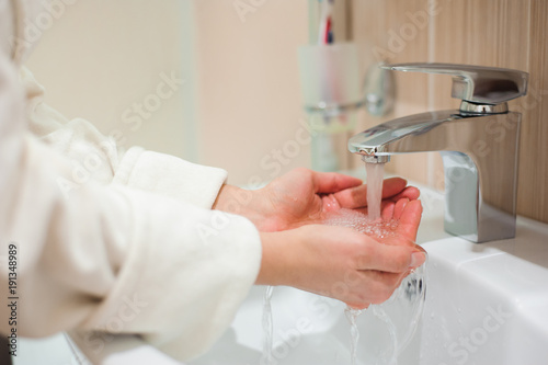 Washing of hands with soap under running water © nagaets