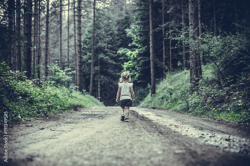 Little Girl Lost in Forest Walking Alone