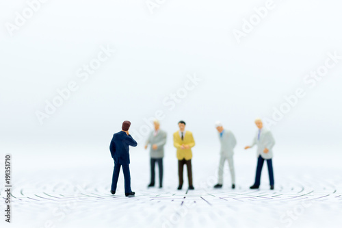 Miniature people: Group of businessmen work with team. Image use for background choice of the best suited employee, HR,job interview, job recruiter concepts.