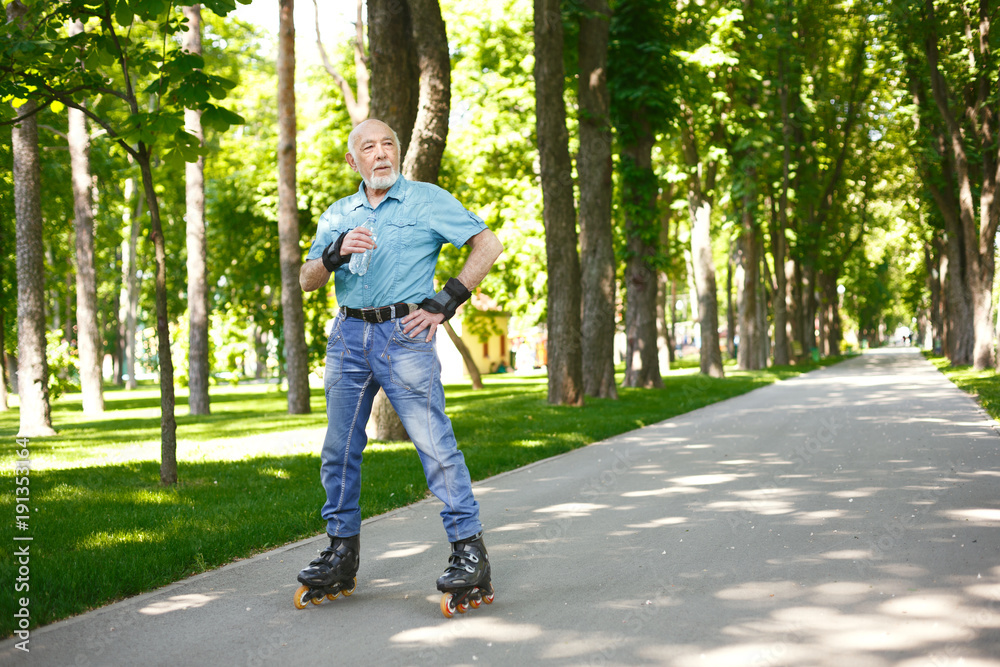 Senior man in casual wear with water bottle Senior man in casual wear with water bottle