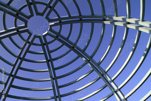 Blue sky behind metal roof frame photo