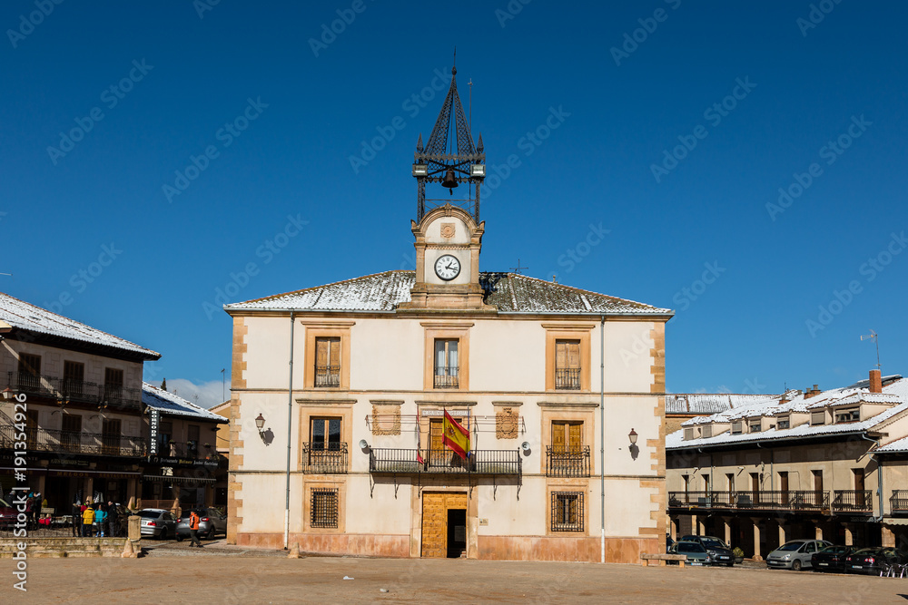 Town Hall of Riaza, Segovia, with traces of snow on the roofs of houses