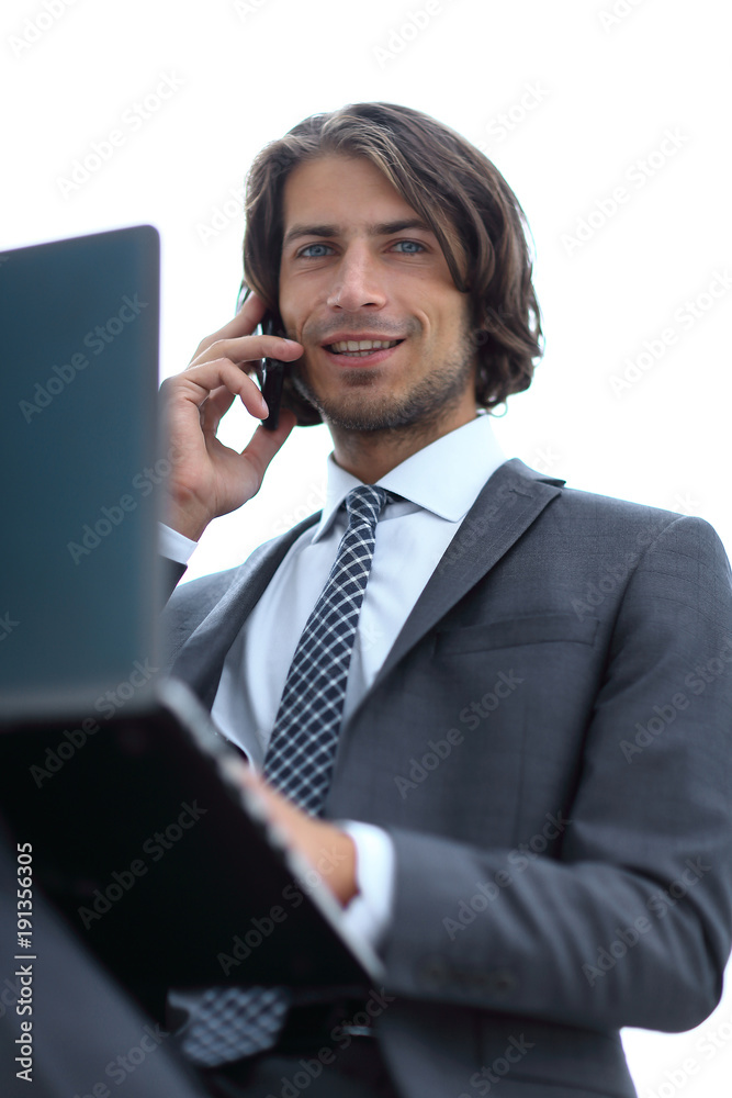 closeup.successful businessman talking on mobile closeup.successful businessman talking on mobile