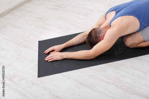 Woman training yoga pose, copy space