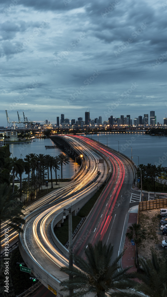 Miami port view, sunset, city bridge curve. Keep moving