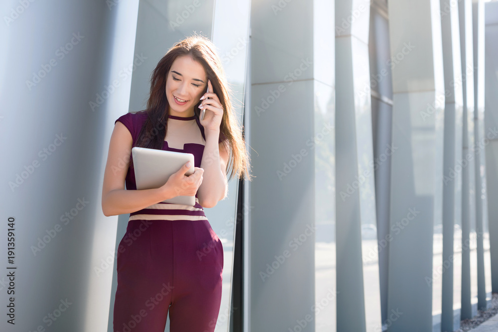 Businesswoman working with papers outdoors