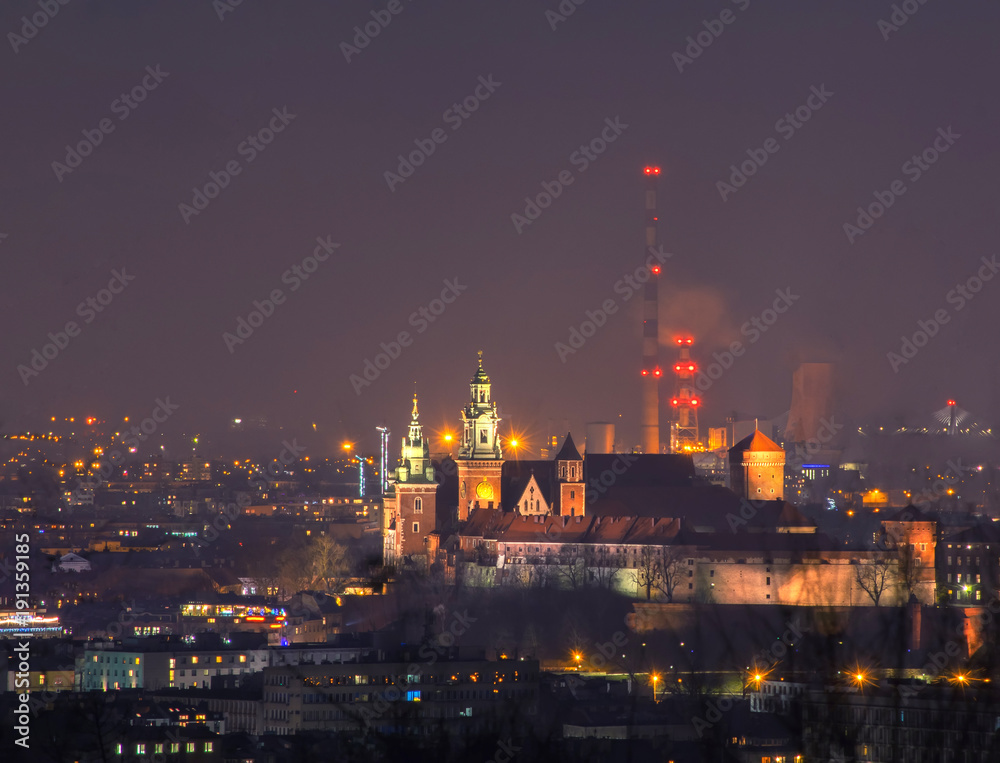 Wawel castle and power plant pipes at night, Krakow, Poland