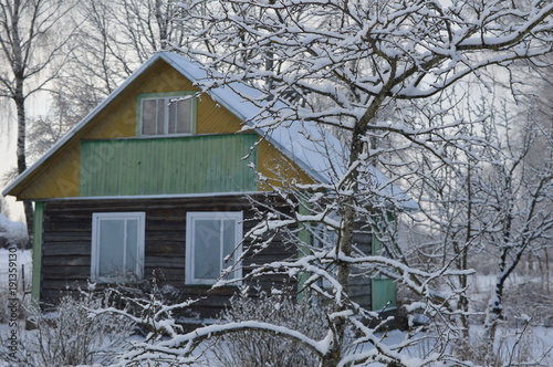 Winter snow home in the village photo