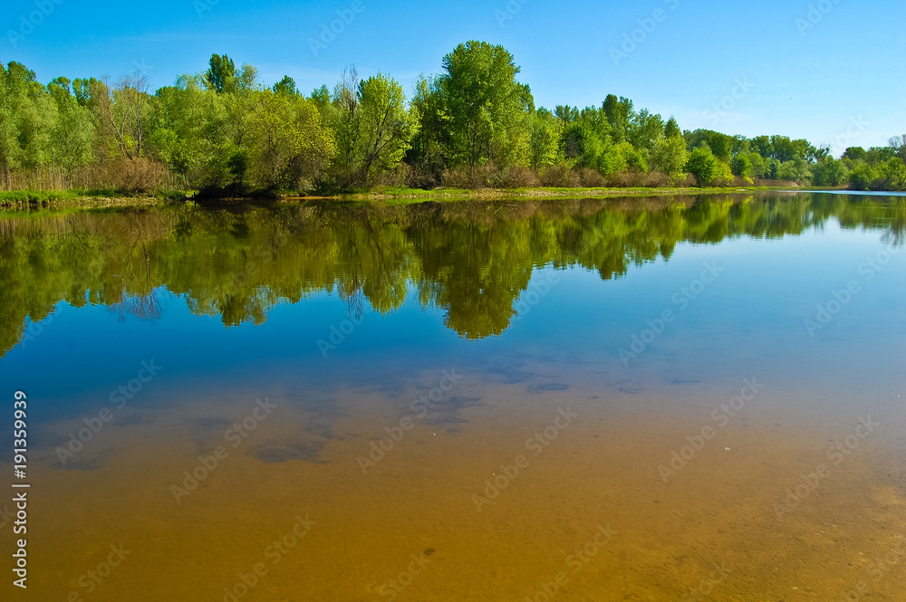 Spring reflections in the waters of the Dnieper River