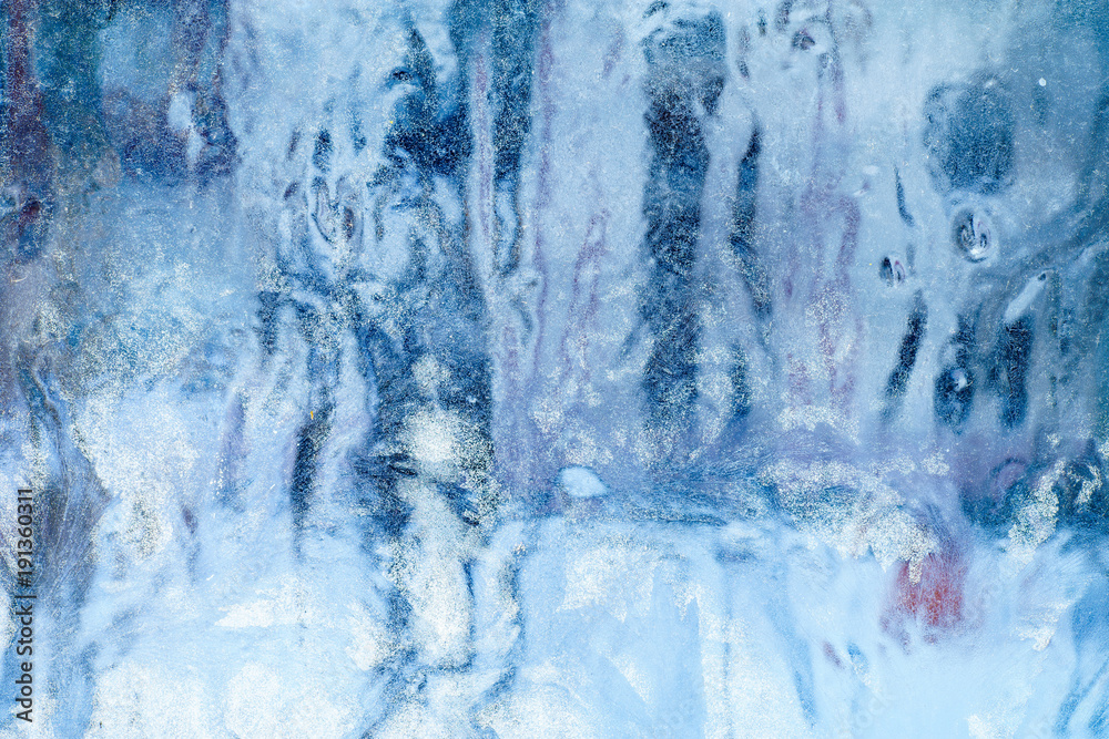 Frosty pattern on the window. Beautiful natural background. Winter theme. Close-up Frosty pattern on the window. Beautiful natural background. Winter theme. Close-up