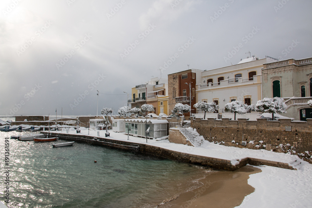 Ionian coast after a exceptional snowfall, santa maria al bagno, salento, italy