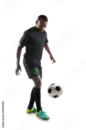 Fototapeta Naklejka Na Ścianę i Meble -  African American Soccer Player Controlling Ball