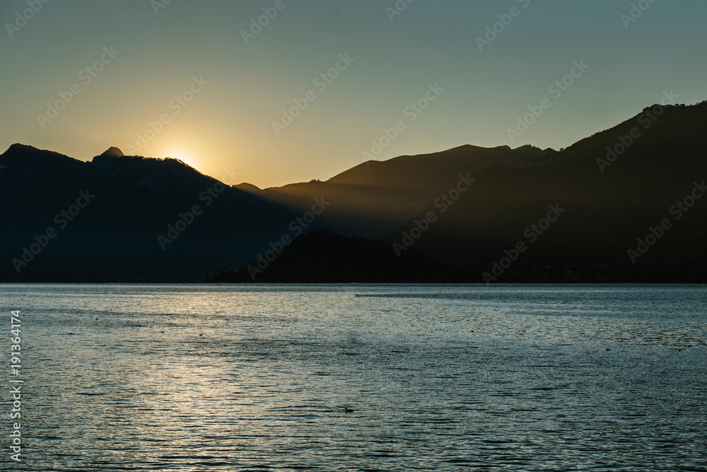 Scenic view of Como lake with Alps mountains in background.