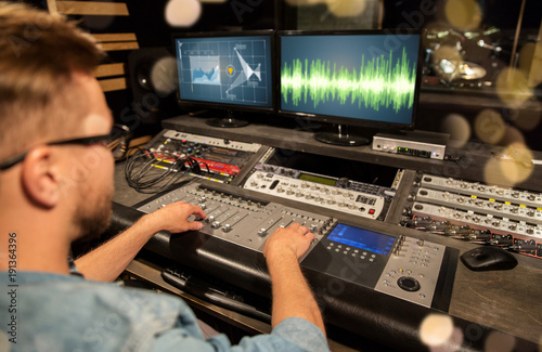 Obraz na płótnie man at mixing console in music recording studio