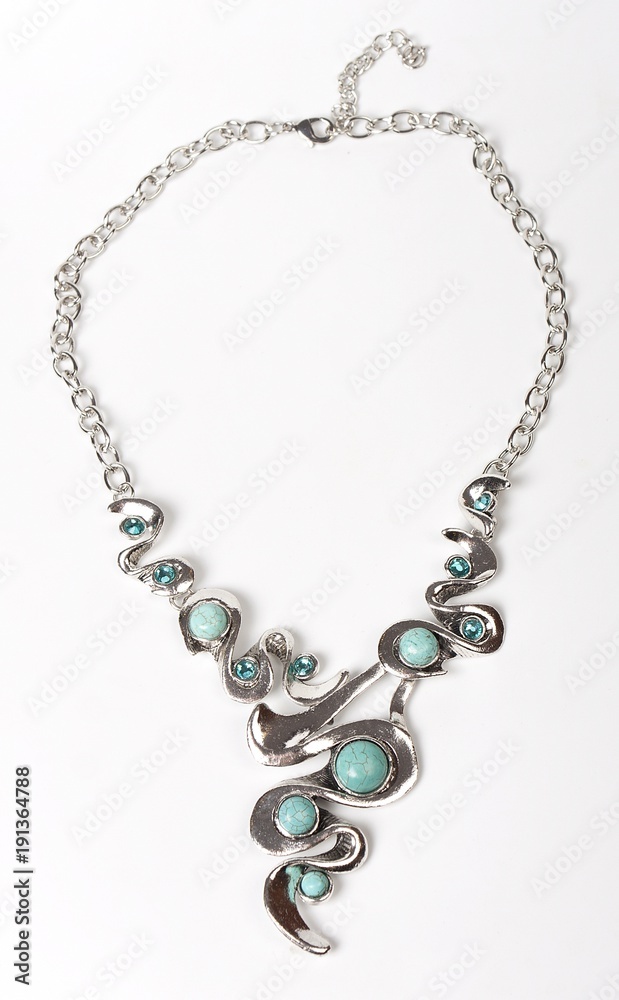 Necklace with stones on a white background. Bijouterie. Women's accessories. Necklace on the neck. Valuable jewelry.Decorating for women.Women's accessories isolated white background Necklace with stones on a white background. Bijouterie. Women's accessories. Necklace on the neck. Valuable jewelry.Decorating for women.Women's accessories isolated white background