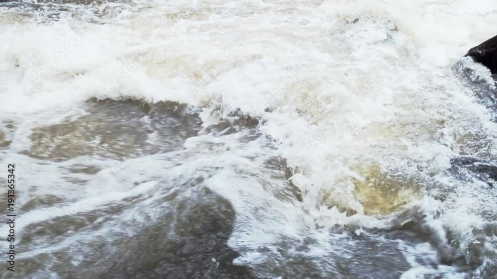 Water flowing through waterfall. Slow motion shot. White water in thailand. Water flowing through waterfall. Slow motion shot. White water in thailand.
