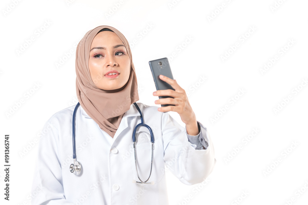 Hijab medical doctor use a phone. Healthy concept. Hijab medical doctor use a phone. Healthy concept.