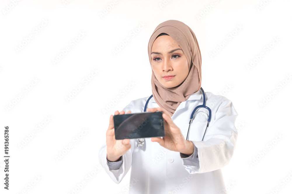 Hijab medical doctor use a phone. Healthy concept. Hijab medical doctor use a phone. Healthy concept.