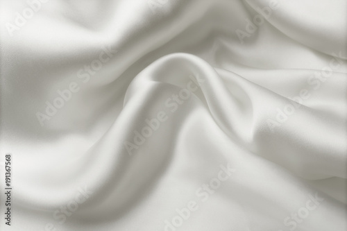 Elegant white satin silk with waves, abstract background