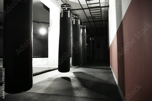 Interior of modern gym with punching bags