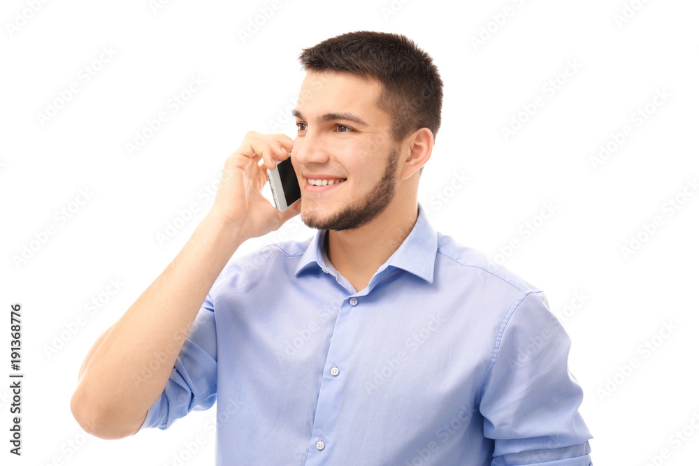 Young man talking on cell phone against white background Young man talking on cell phone against white background