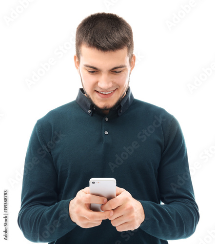 Young man using cell phone ...