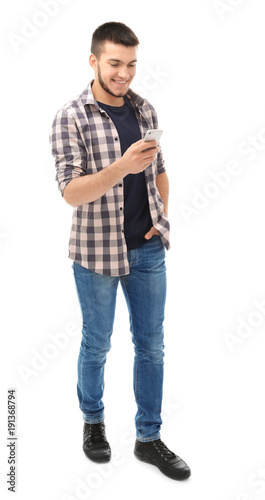 Young man using cell phone ...