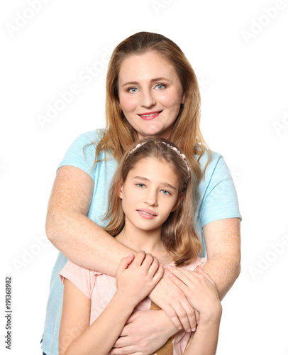 Portrait of happy mother and daughter on white background