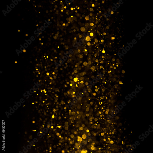 Abstract golden shiny glitter bokeh lights background