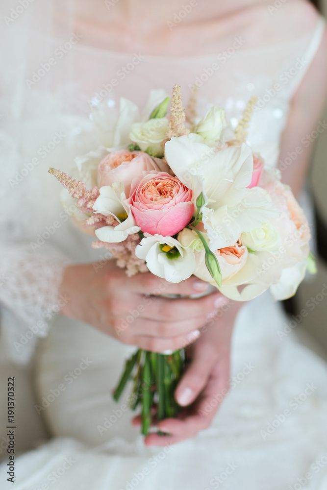 wedding bouquet in the hands of the bride wedding bouquet in the hands of the bride