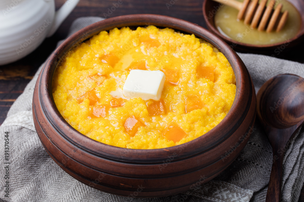 Millet porridge with pumpkin in a clay bowl Millet porridge with pumpkin in a clay bowl