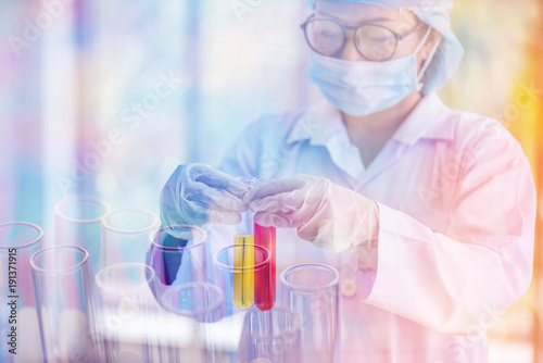 scientist holding laboratory test tube in hand , science research concept