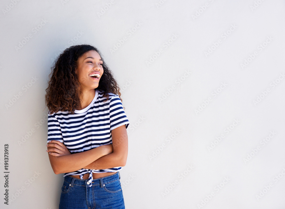 happy young african american woman standing against white background happy young african american woman standing against white background