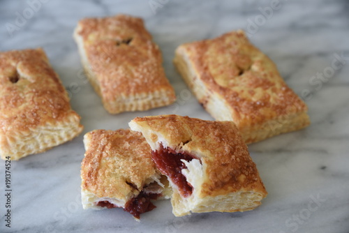 Sweet pastries on marble surface, close-up